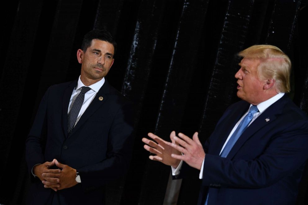 PHOTO: President Donald Trump delivers remarks on immigration and border security as Acting secretary of Homeland Security Chad Wolf looks on at the international airport in Yuma, Ariz., Aug. 18, 2020.