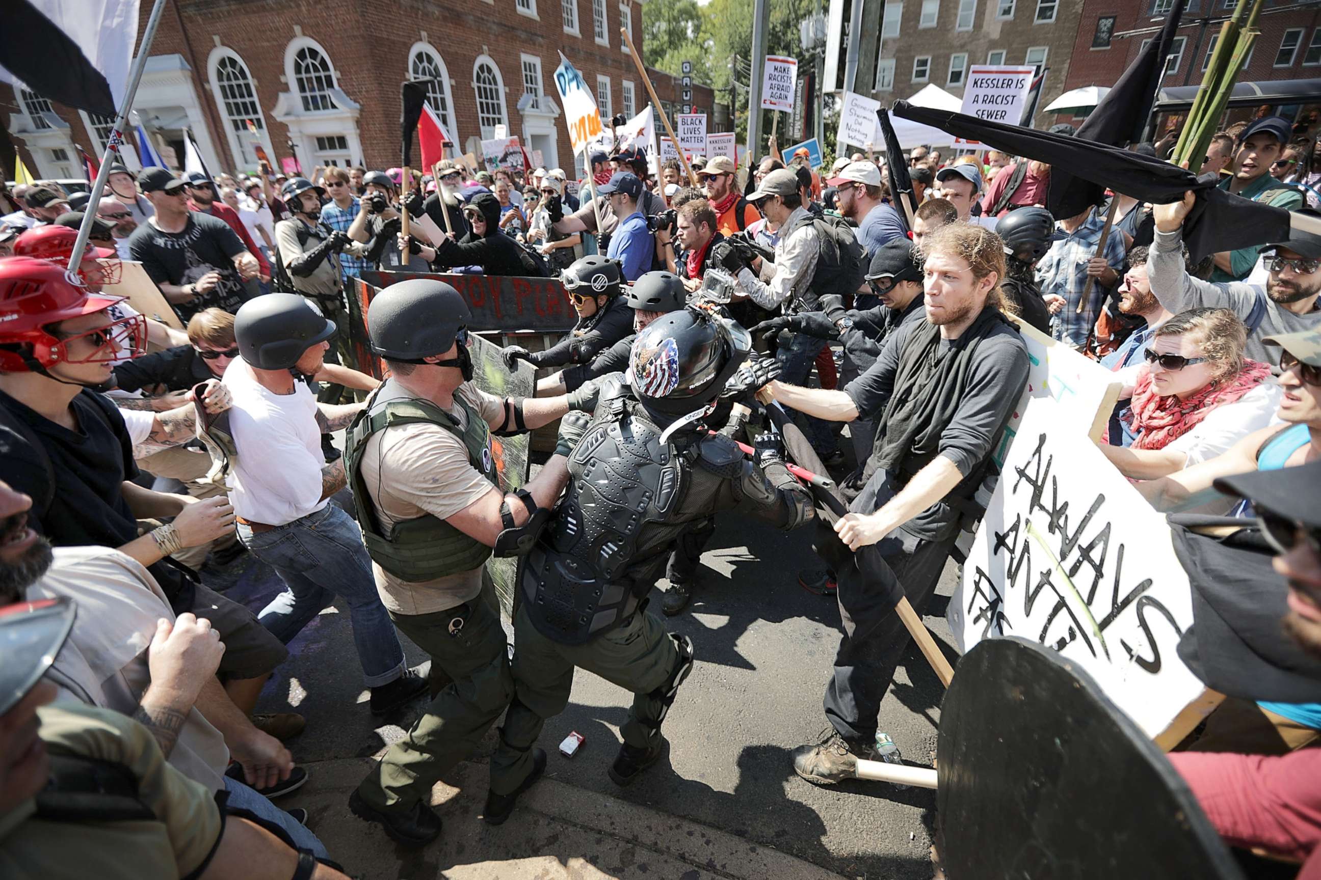PHOTO: White nationalists, neo-Nazis and members of the "alt-right" clash with counter-protesters as they enter Lee Park during the "Unite the Right" rally, Aug. 12, 2017, in Charlottesville, Va. 