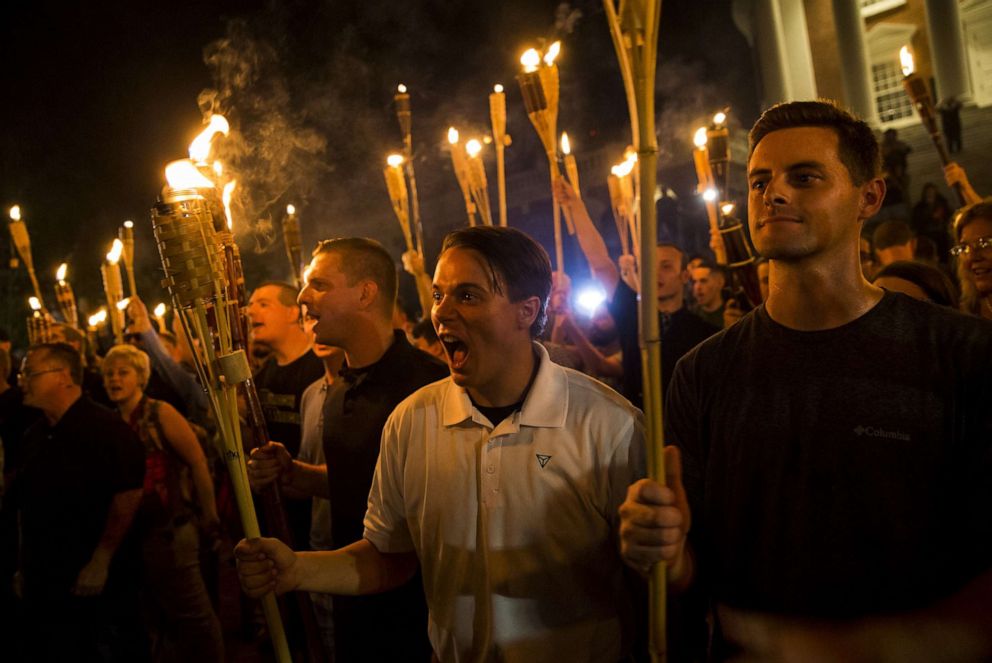 PHOTO: Far-right extremists encircle counter protestors at the base of a statue of Thomas Jefferson in Charlottesville, Va., Aug. 11, 2017.