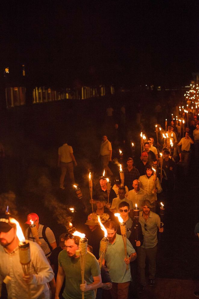 PHOTO: In this Aug. 11, 2017, file photo, white supremacists march with tiki torchs through the University of Virginia campus, in Charlottesville, Va.