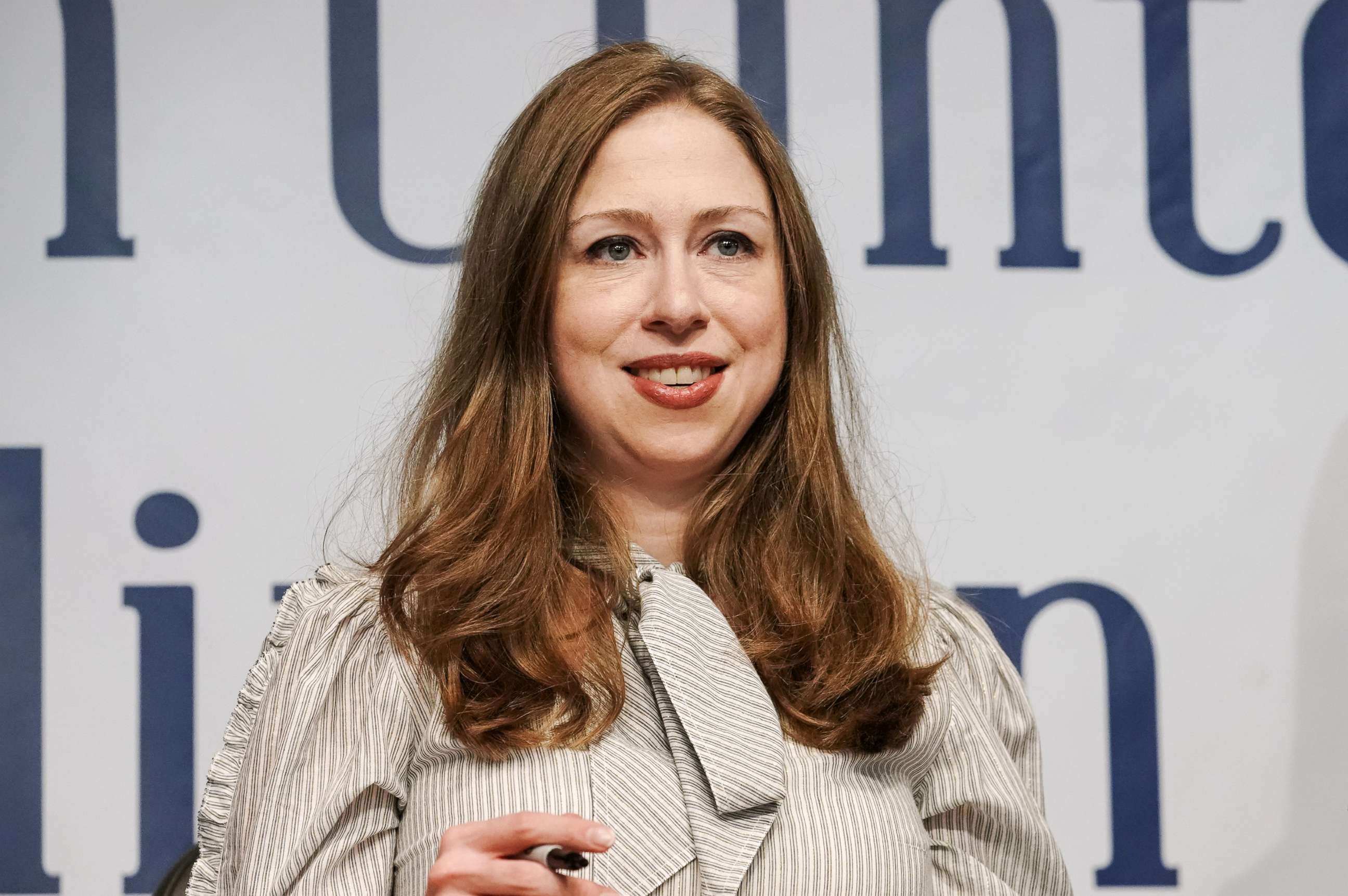 PHOTO: Chelsea Clinton signs a book during an event for "The Book of Gutsy Women," a book by her and her mother Hillary Clinton, in New York, Oct. 3, 2019.