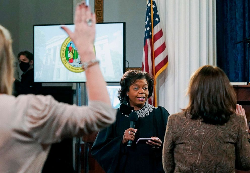 PHOTO: In this Dec. 14, 2020 file photo Chief Justice of the N.C. Supreme Court Cheri Beasley, center, swears in Presidential electors of North Carolina's Electoral College as they gather to cast their votes at the State Capitol Building in Raleigh, N.C.
