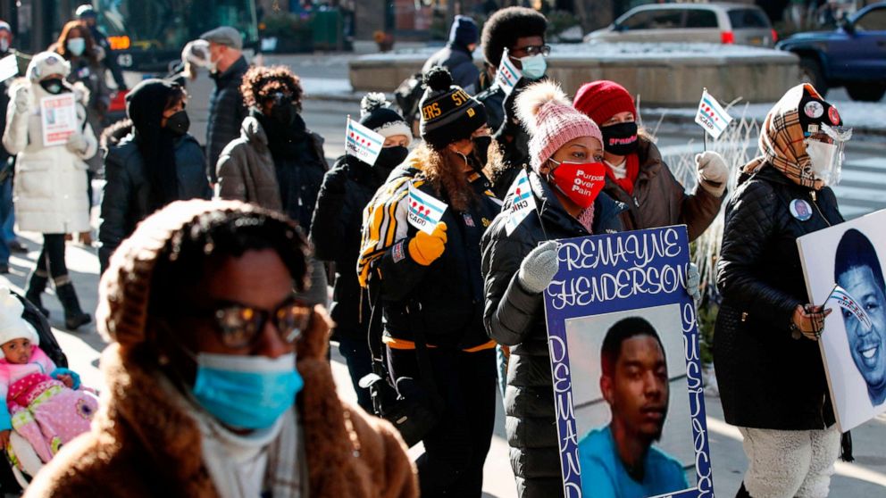 PHOTO: People participate in a march against gun violence on the Magnificent Mile in Chicago on Dec. 31, 2020.