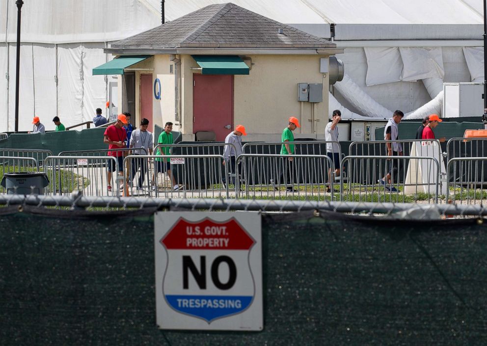 PHOTO: Young people walk the grounds of the Homestead Temporary Shelter for Unaccompanied Children in Homestead, Fla., July 15, 2020.