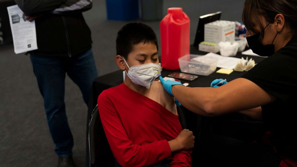 PHOTO: A youngster receives the Pfizer COVID-19 vaccine at a pediatric vaccine clinic for children ages 5 to 11 set up at Willard Intermediate School in Santa Ana, Calif., Nov. 9, 2021.