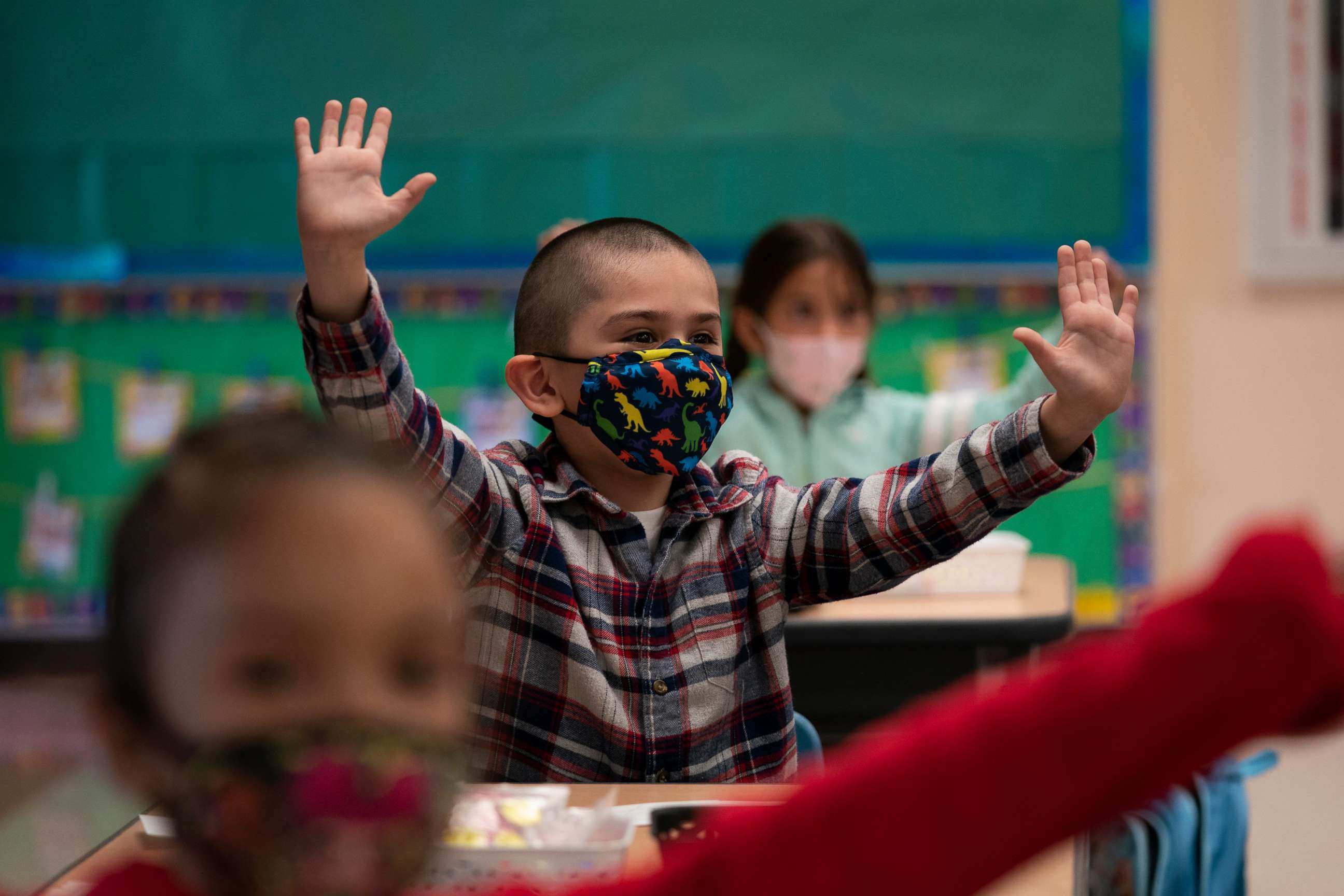 PHOTO: Kindergarten students participate in a classroom activity on the first day of in-person learning at Maurice Sendak Elementary School in Los Angeles, April 13, 2021.