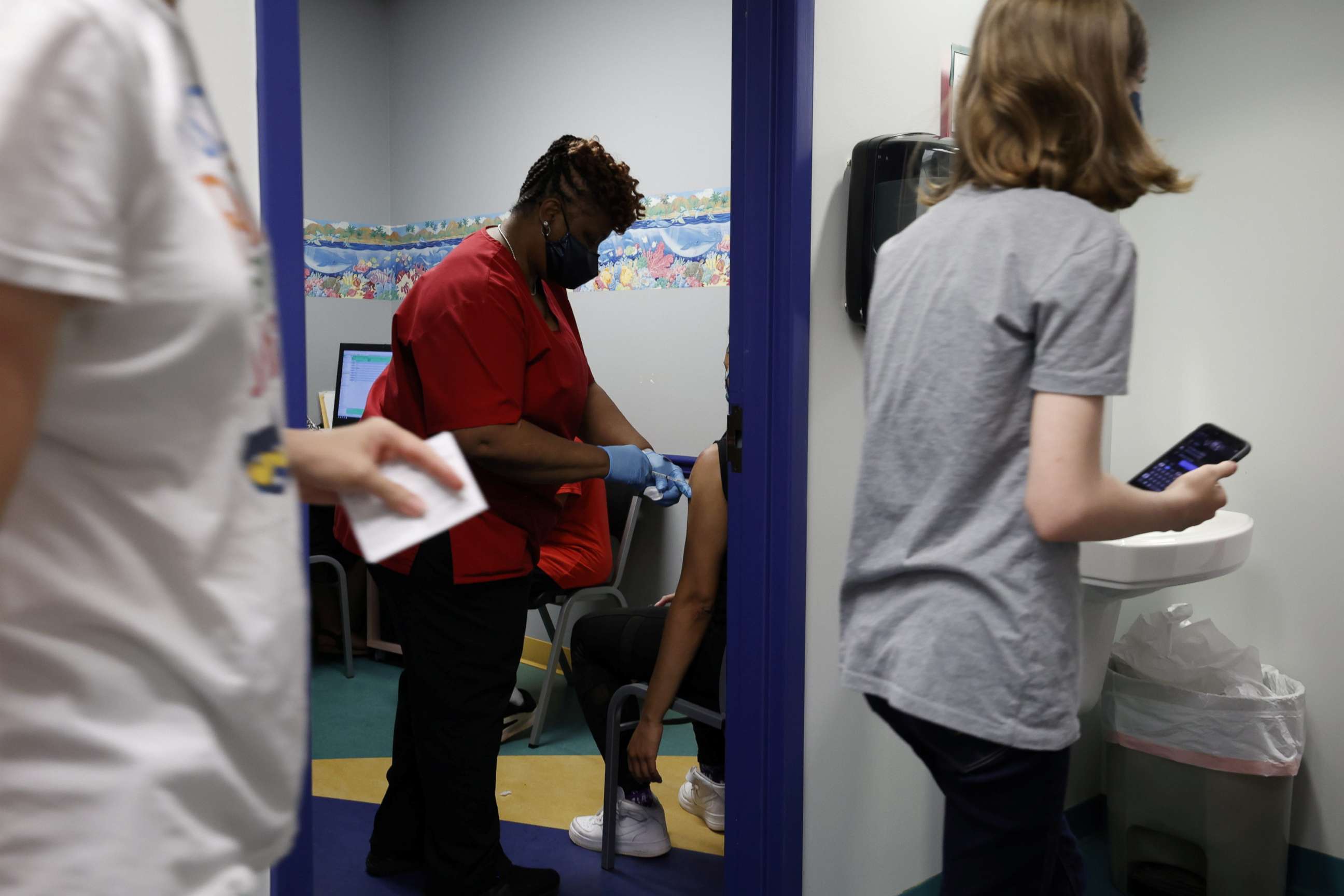 PHOTO: Registered Medical Assistant Melissa Dalton inoculates a teenager with the Pfizer vaccine against coronavirus disease after Georgia authorized the vaccine for children over 12 years old, at Dekalb Pediatric Center in Decatur, Ga., May 11, 2021.