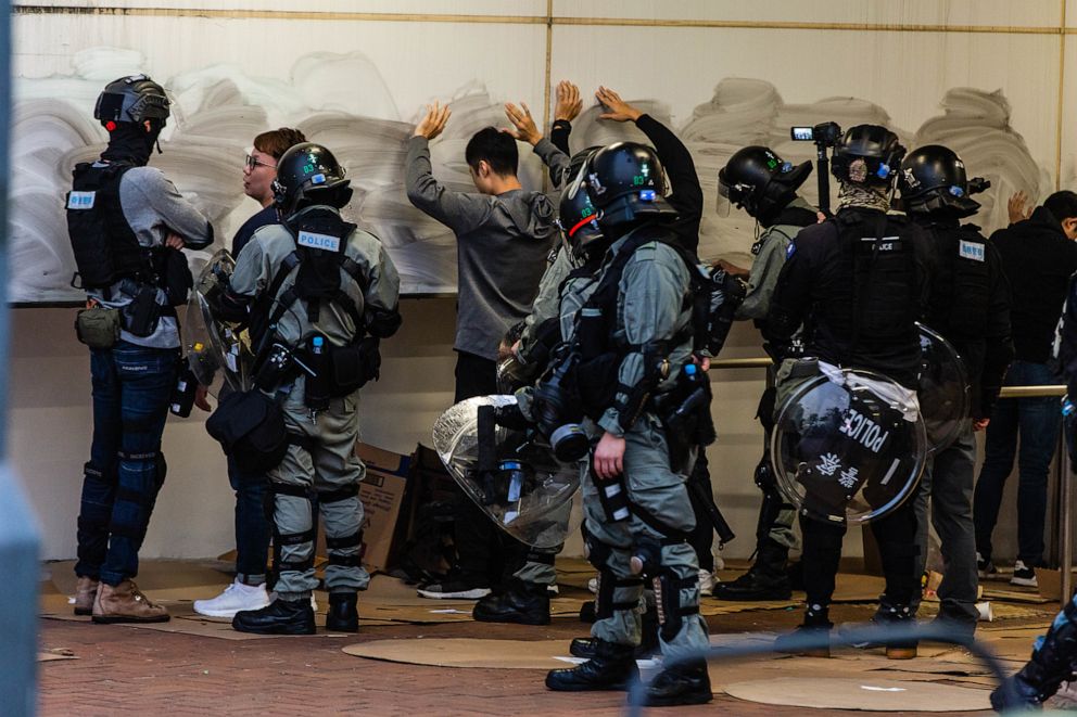 PHOTO: Riot policemen stop and search protesters during a demonstration in Hong Kong, Sept. 12, 2019.