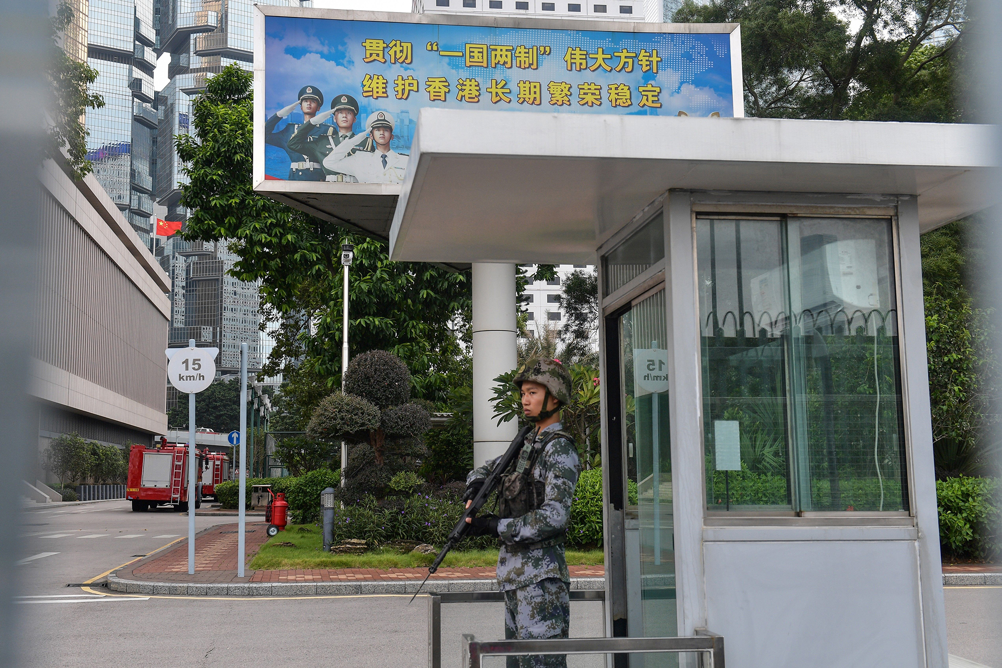 PHOTO: A Chinese soldier stands guard at an entrance to the headquarters of the People's Liberation Army in Hong Kong, Oct. 7, 2019. 