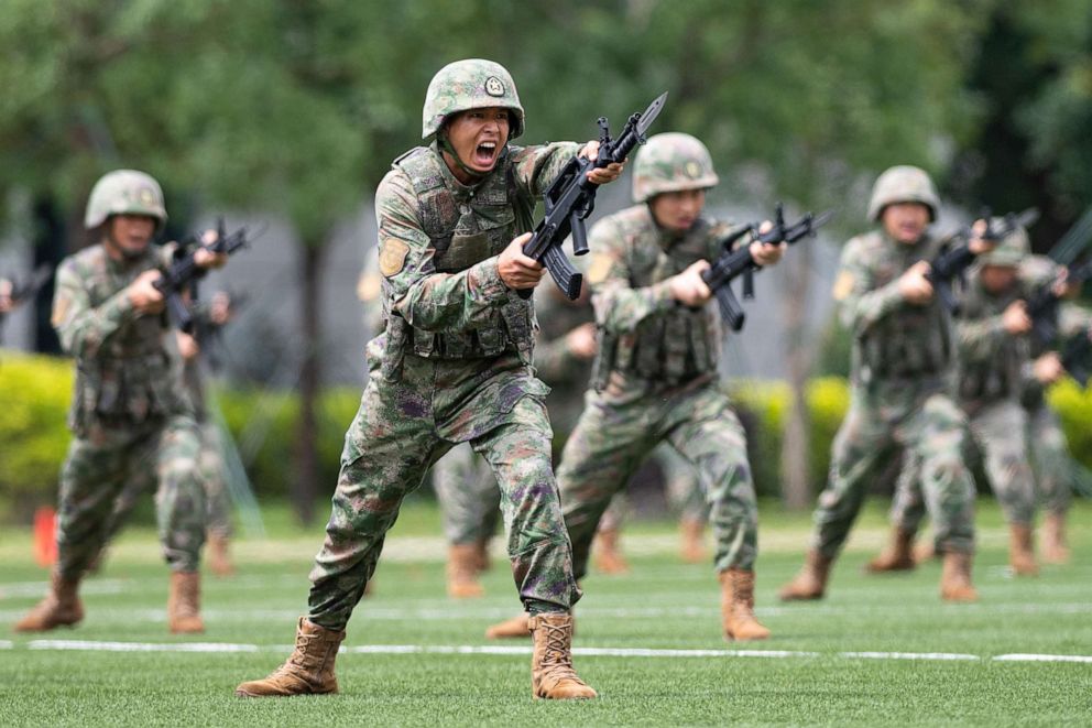 PHOTO: Soldiers of the Chinese People's Liberation Army Garrison stationed in the Macao Special Administrative Region stage military exercises during an open day event at the barracks on Taipa Island in Macao, south China, April 30, 2023.