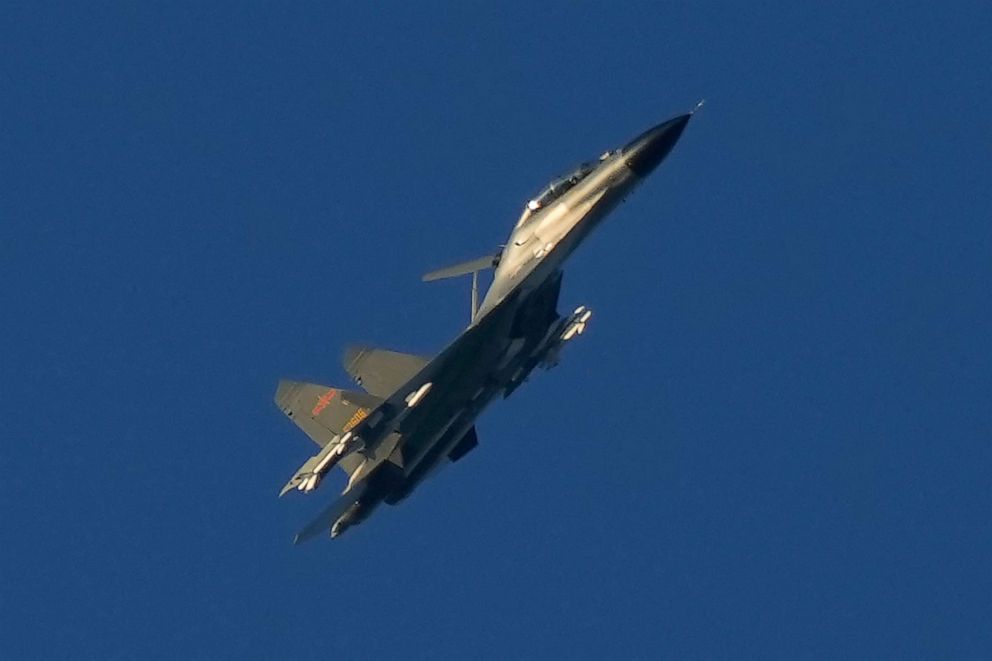 PHOTO: A Chinese J-11 military fighter jet flies over the Taiwan Strait near Pingtan, the closest land on the Chinese mainland to the island of Taiwan, in Pingtan, southeast China's Fujian Province, August 5, 2022. 