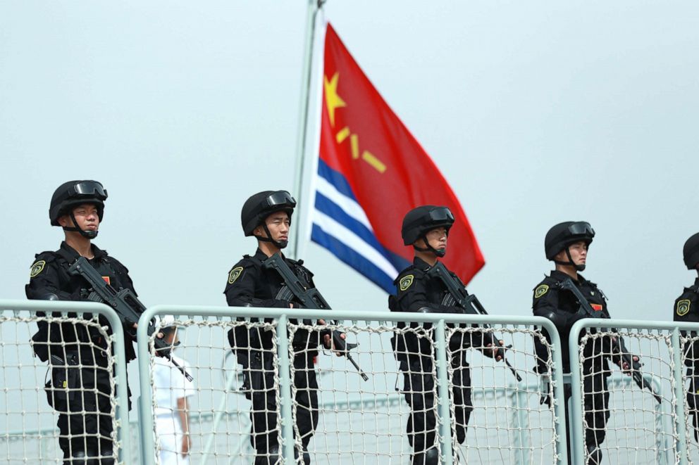 PHOTO: Members of the Chinese Navy stand on the deck of a navy ship at a military port on May 18, 2022 in Zhoushan, Zhejiang Province of China.