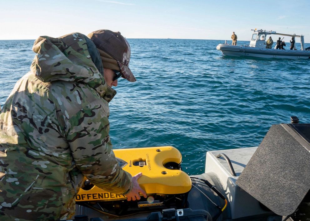 PHOTO: Sailors assigned to Explosive Ordnance Disposal Group 2 prepare an underwater vehicle to search for debris during recovery efforts of a high-altitude balloon in the Atlantic Ocean, Feb. 7, 2023.