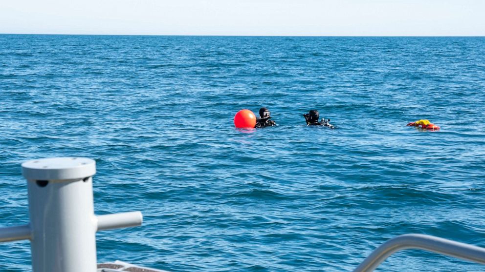 PHOTO: Sailors assigned to Explosive Ordnance Disposal Group 2 prepare to conduct a search for debris during recovery efforts of a high-altitude balloon in the Atlantic Ocean, Feb. 7, 2023.