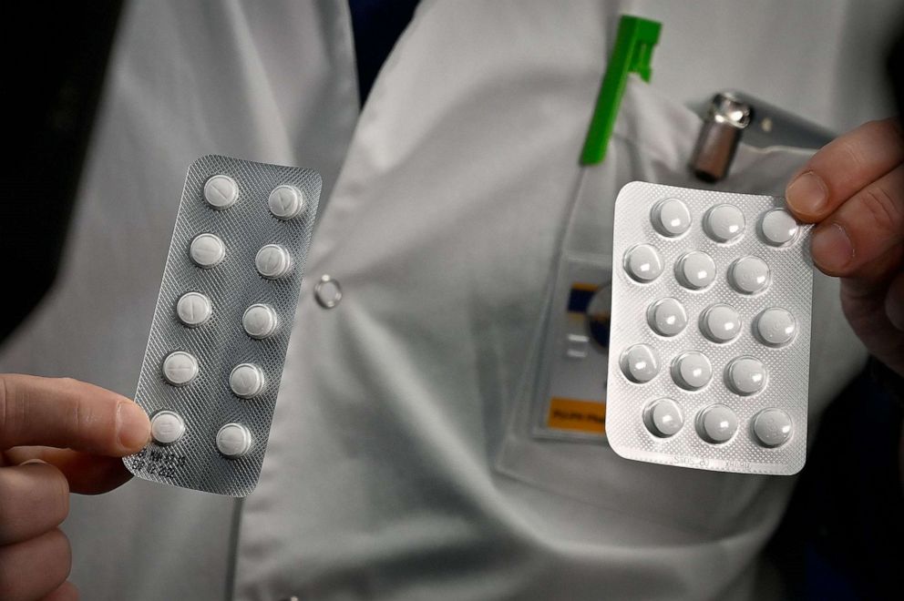 PHOTO: Medical staff of the IHU Mediterranee Infection Institute in Marseille, France, Feb. 26, 2020, shows packets of a Nivaquine, tablets containing chloroquine and Plaqueril, drugs that has shown signs of effectiveness against coronavirus.