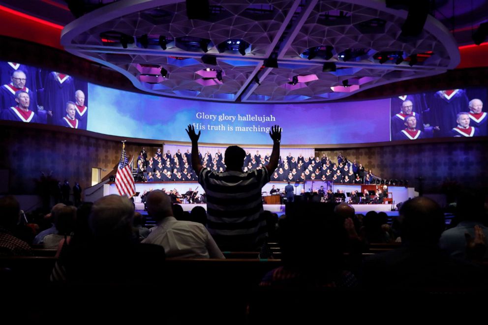 PHOTO: The choir sings as an attendee stands before Vice President Mike Pence made comments at First Baptist Church Dallas during a Celebrate Freedom Rally in Dallas, June 28, 2020.