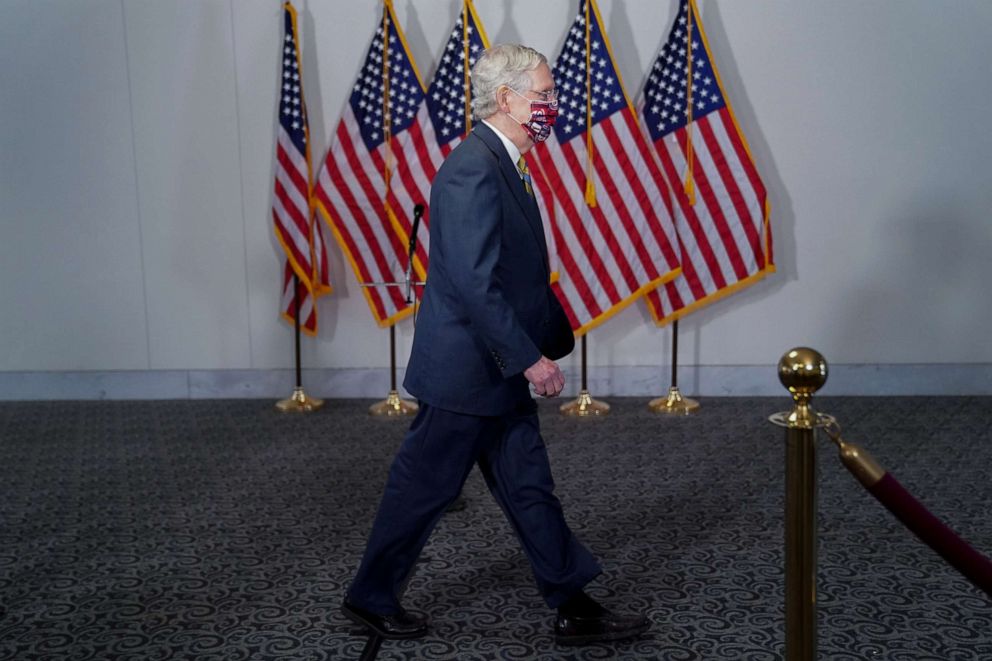 PHOTO: Senate Majority Leader Mitch McConnell walks in a hallway on Capitol Hill in Washington, July 23, 2020.