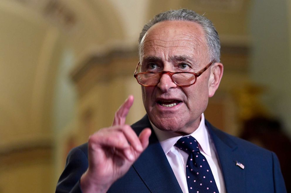 PHOTO: Senate Minority Leader Sen. Chuck Schumer of N.Y., center, speaks to reporters following the weekly policy luncheon on Capitol Hill in Washington, July 9, 2019.