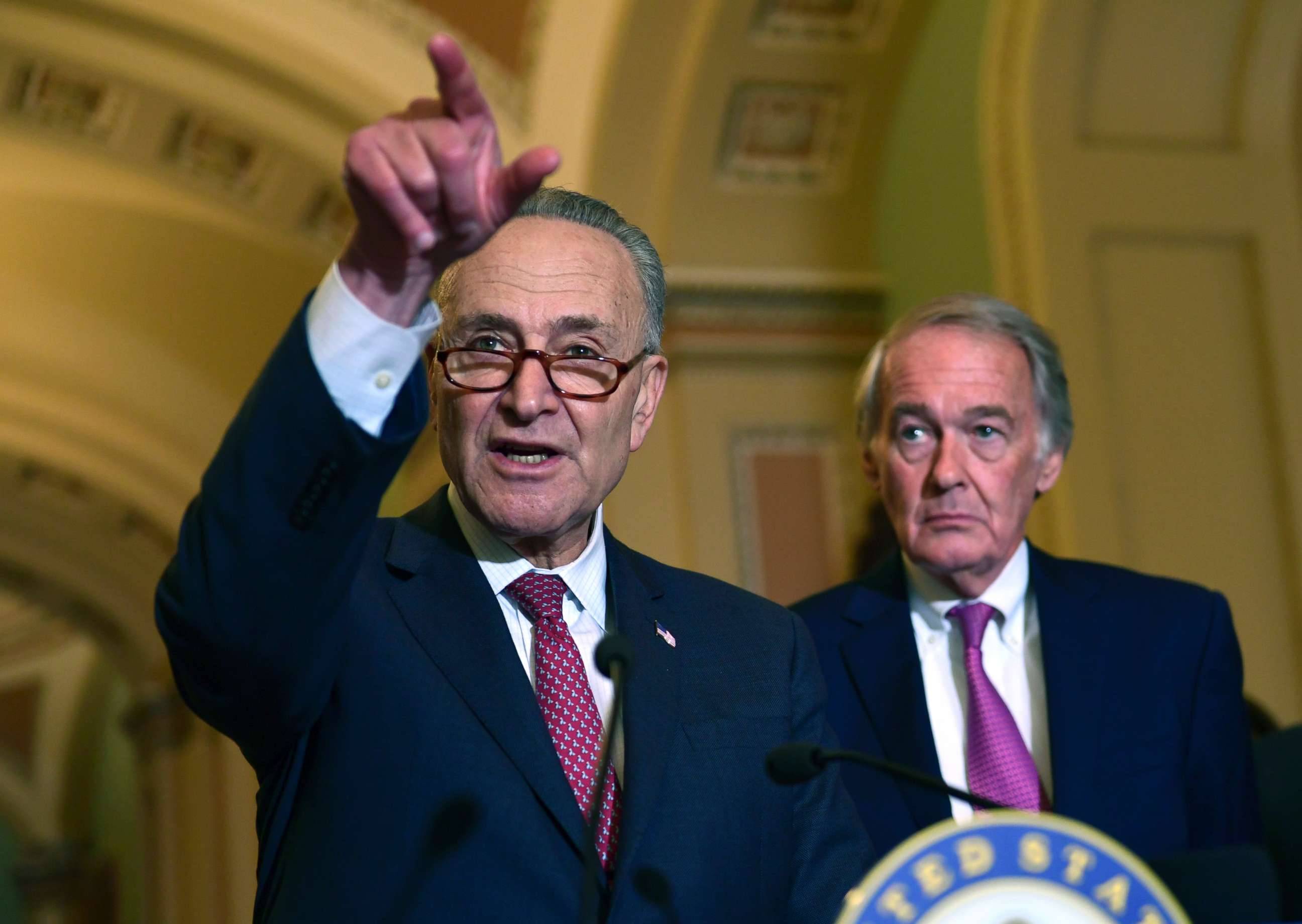 PHOTO: Senate Minority Leader Sen. Chuck Schumer of N.Y., standing with Sen. Edward Markey, D-Mass., speaks to reporters following the weekly Democratic policy luncheon on Capitol Hill in Washington, Oct. 31, 2017. 