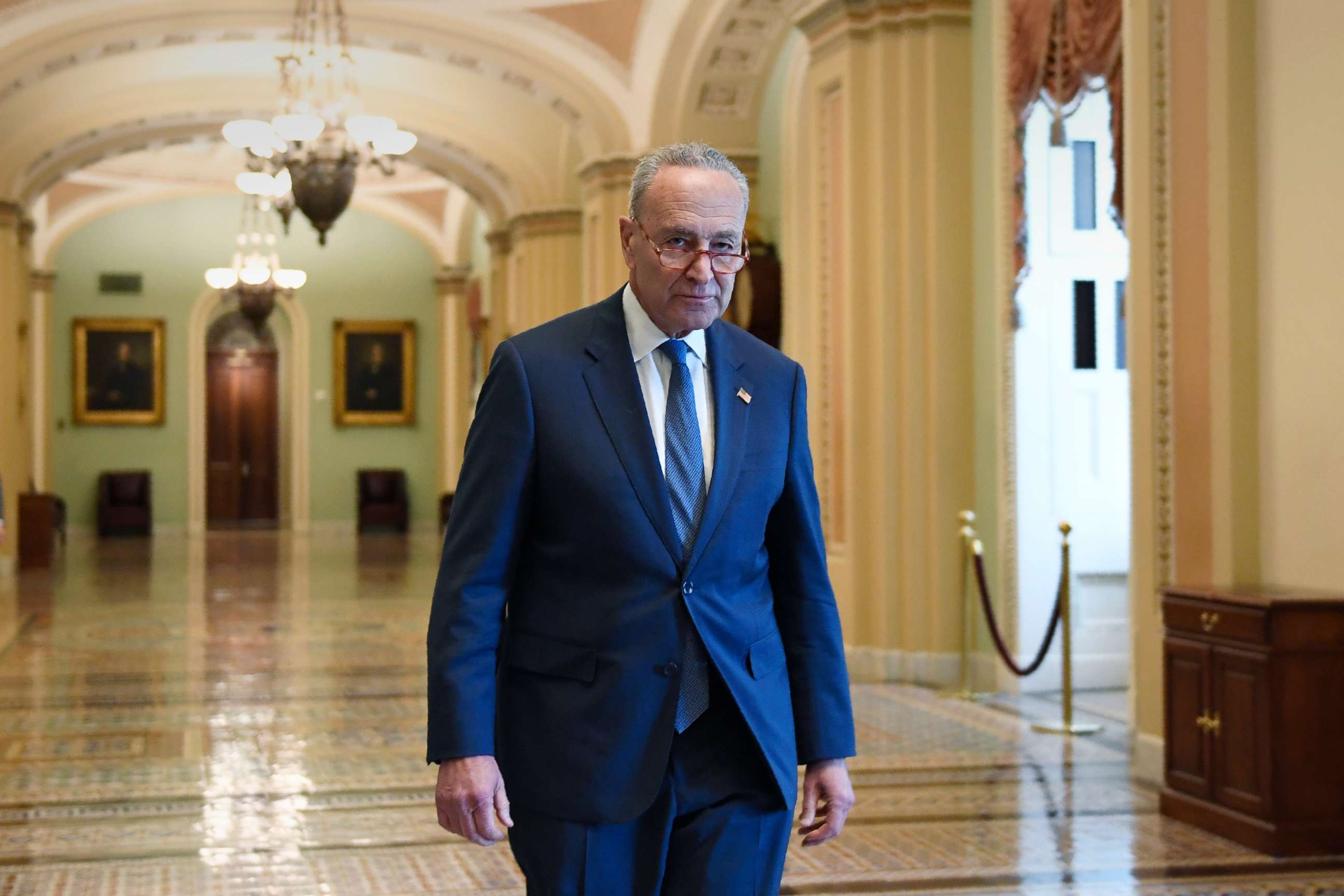 PHOTO: Senate Minority Leader Sen. Chuck Schumer walks in a hallway on Capitol Hill in Washington, D.C., Jan. 3, 2020.