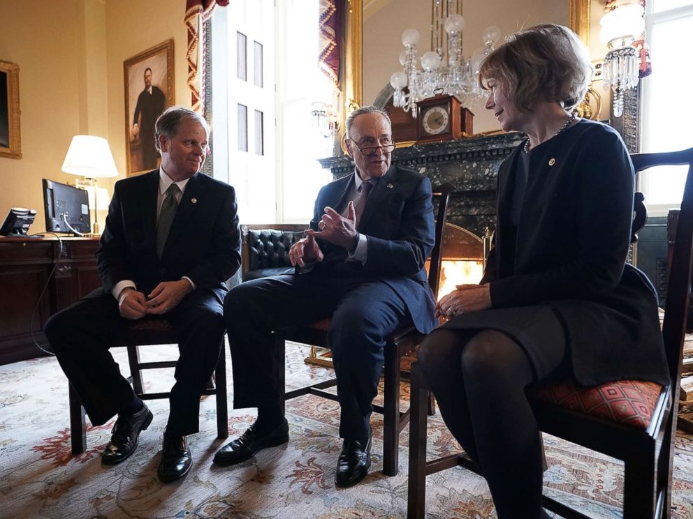 PHOTO: Senate Minority Leader Chuck Schumer, center, speaks to Sen. Doug Jones and Sen. Tina Smith during a meeting at the U.S. Capitol, Jan. 3, 2018, in Washington.