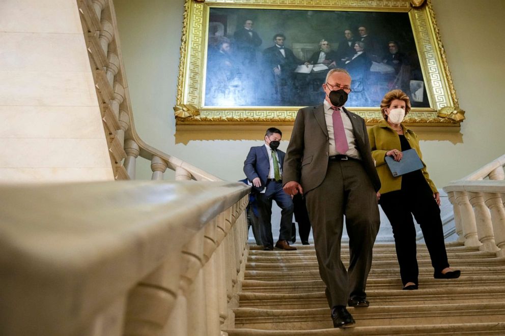 PHOTO: Senate Majority Leader Chuck Schumer and Sen. Debbie Stabenow leave a news conference at the U.S. Capitol, Jan. 11, 2022, in Washington, DC.