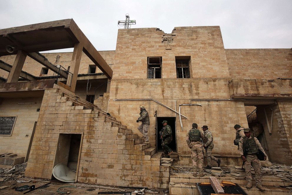 PHOTO: Iraqi soldiers inspect the debris on January 22, 2017 at St. George's Monastery (Mar Gurguis), a historical Chaldean Catholic church on the northern outskirt of Mosul, which was destroyed by Islamic State (IS) group in 2015.