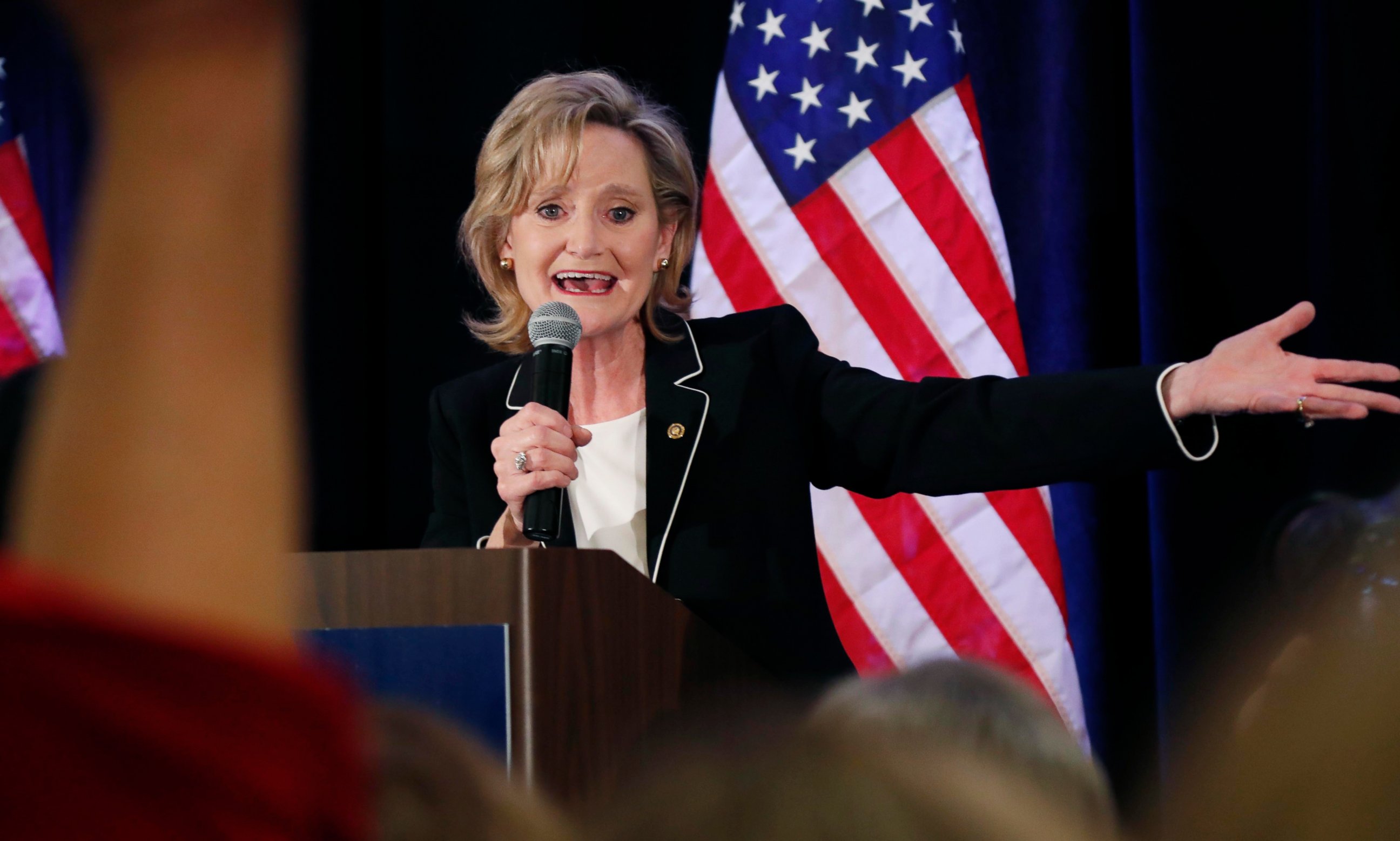 PHOTO: Republican U.S. Sen. Cindy Hyde-Smith calls on her family members to identify themselves as she celebrates her runoff win over Democrat Mike Espy in Jackson, Miss., Tuesday, Nov. 27, 2018.