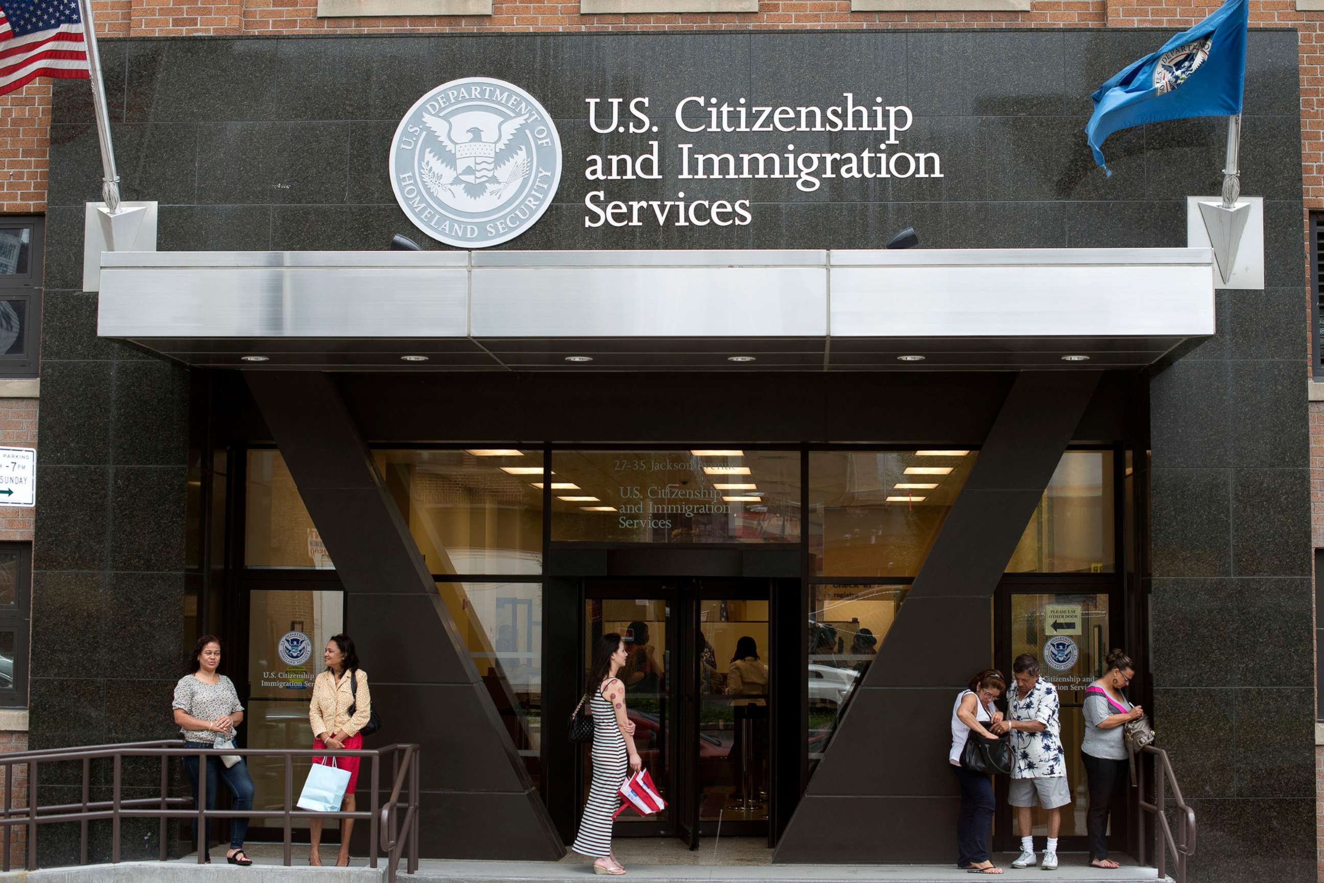 PHOTO: In this Aug. 15, 2012, file photo, people stand on the steps of the U.S. Citizenship and Immigration Services offices in New York.