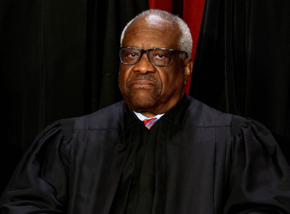 PHOTO: Supreme Court Associate Justice Clarence Thomas poses during a group portrait at the Supreme Court in Washington, October 7, 2022.