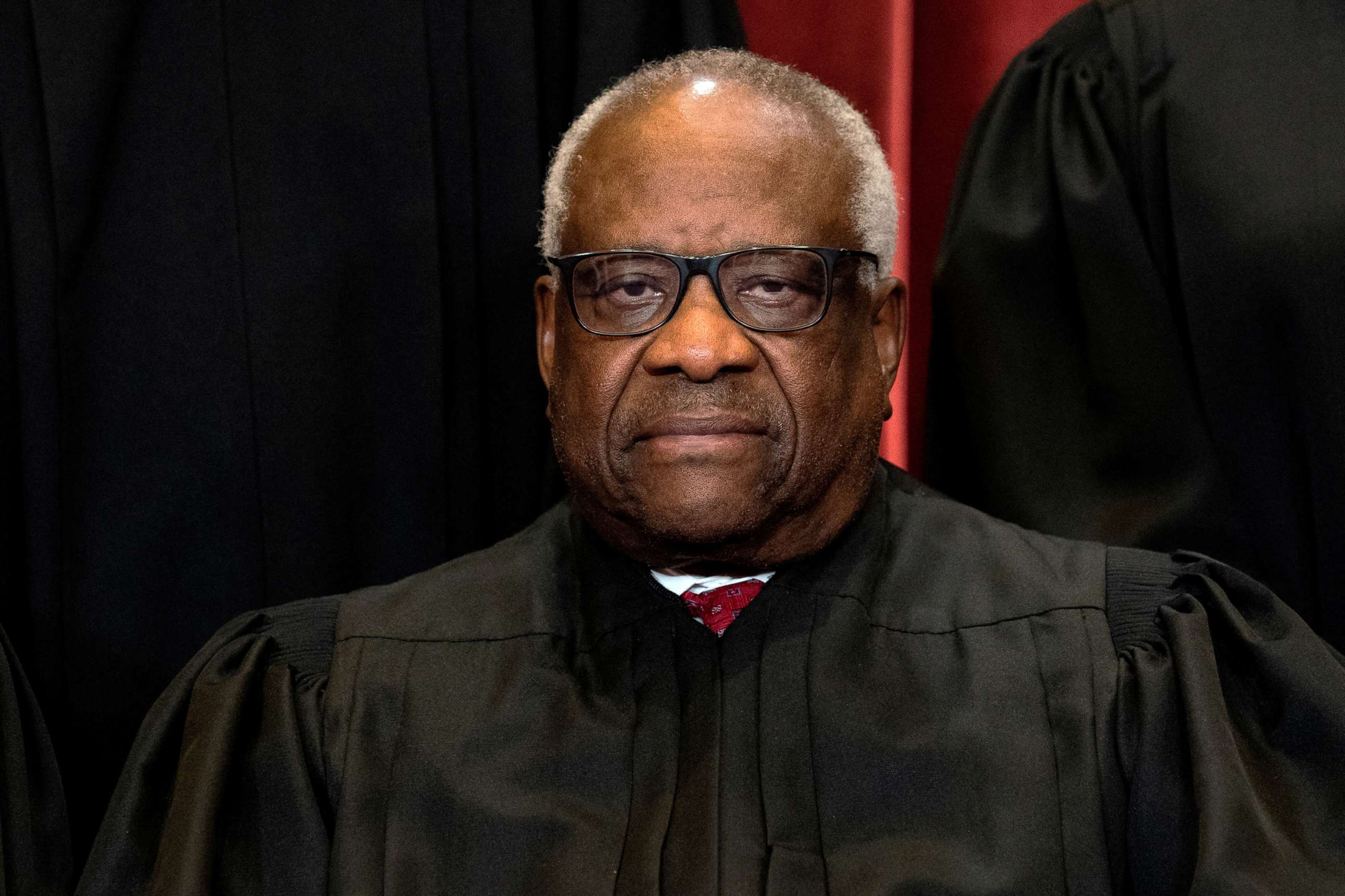 PHOTO: In this April 23, 2021, file photo, Associate Justice Clarence Thomas poses during a group photo of the Justices at the Supreme Court in Washington, D.C.