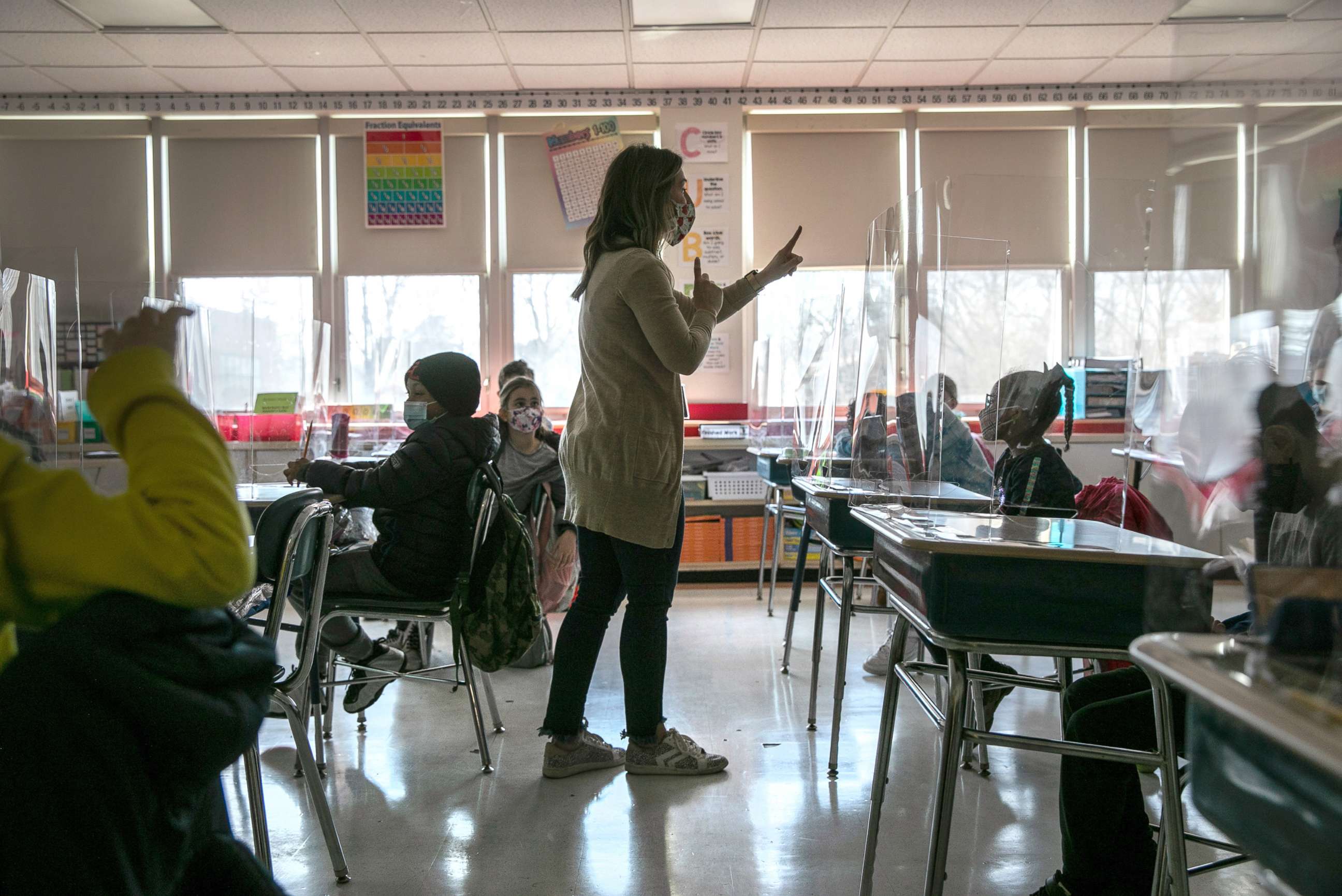 PHOTO: Third grade literacy instructor Katelyn Battinelli talks with students about their pandemic-related fears on the first day of in-person learning for five days per week at Stark Elementary School, March 10, 2021, in Stamford, Conn.
