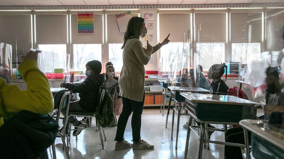 PHOTO: Third grade literacy instructor Katelyn Battinelli talks with students about their pandemic-related fears on the first day of in-person learning for five days per week at Stark Elementary School, March 10, 2021, in Stamford, Conn.