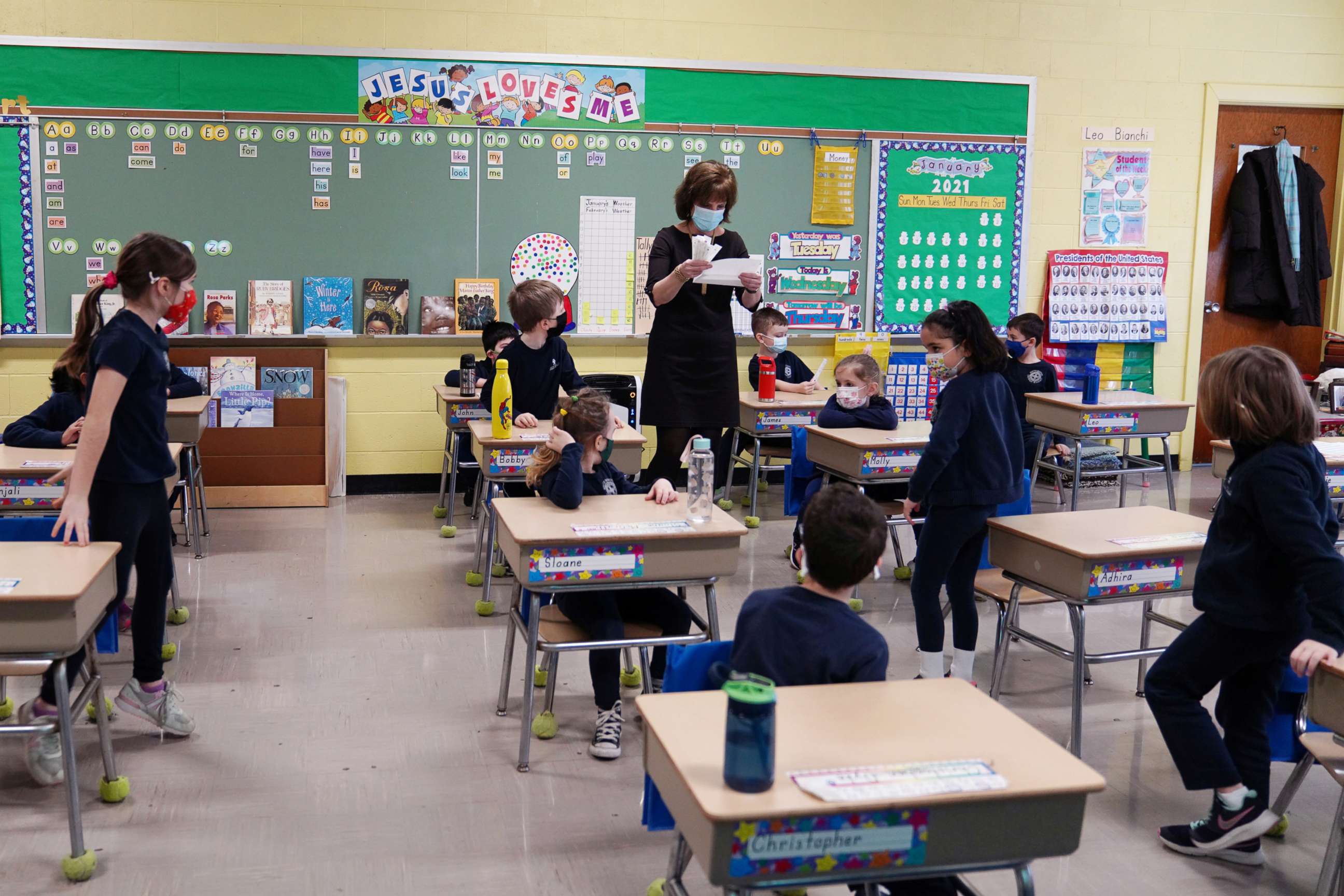 PHOTO: A teacher calls names for schoolchildren to collect a swab and test themselves for COVID-19 in a classroom at South Boston Catholic Academy in Boston, Jan. 28, 2021.