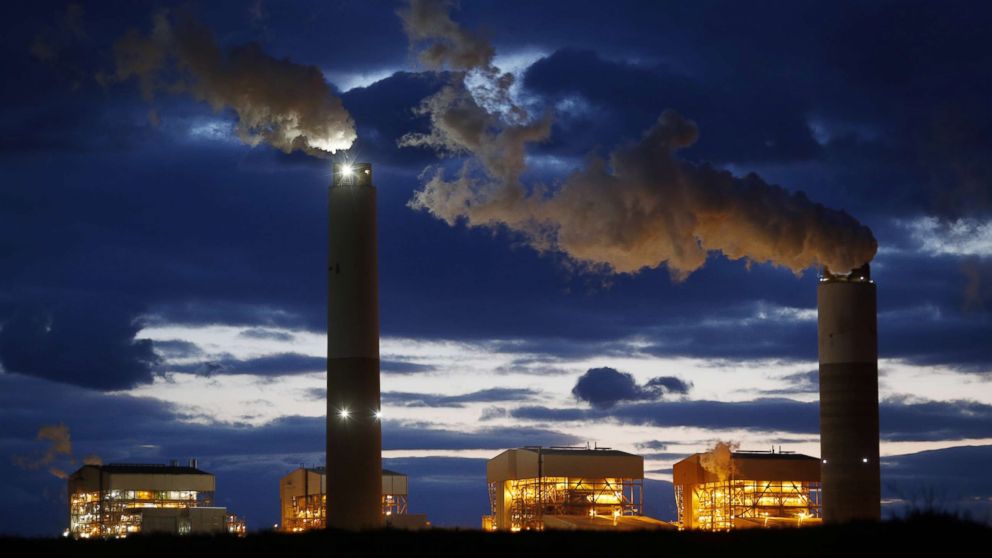 Emissions rise from the coal fired Santee Cooper Cross Generating Station power plant at dusk in Pineville, South Carolina, March 21, 2018.
