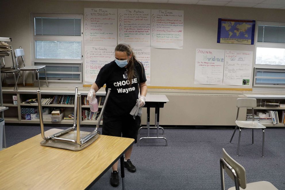 PHOTO: Diane Tomey cleans a classroom at McClelland Elementary School, June 22, 2020, in Indianapolis.