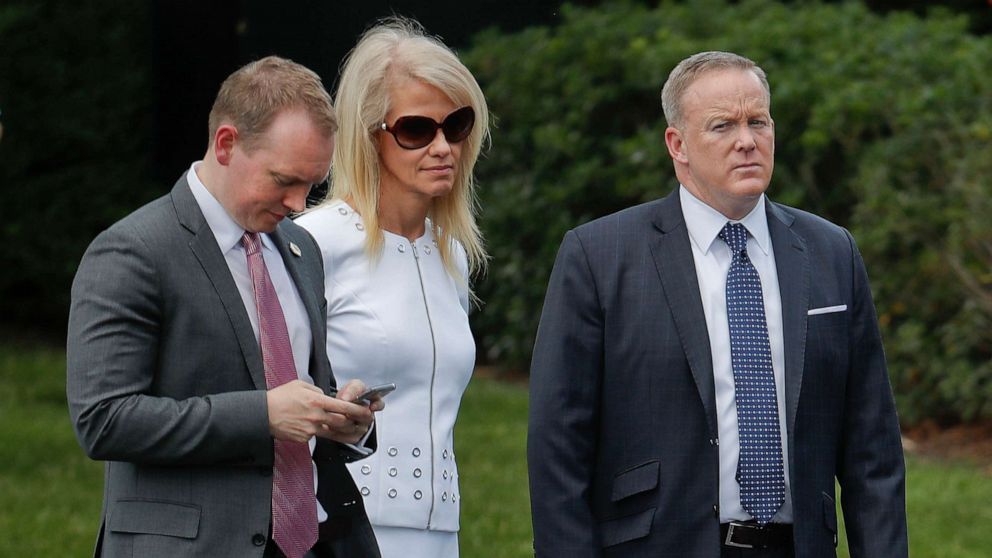 PHOTO: Cliff Sims, left, Director of White House Message Strategy listens to President Donald Trump, June 12, 2017, during a ceremony on the South Lawn of the White House.