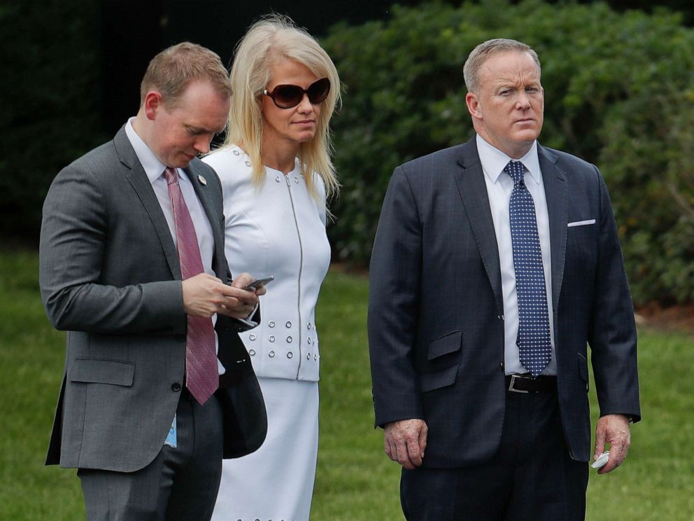 PHOTO: Cliff Sims, left, Director of White House Message Strategy listens to President Donald Trump, June 12, 2017, during a ceremony on the South Lawn of the White House.