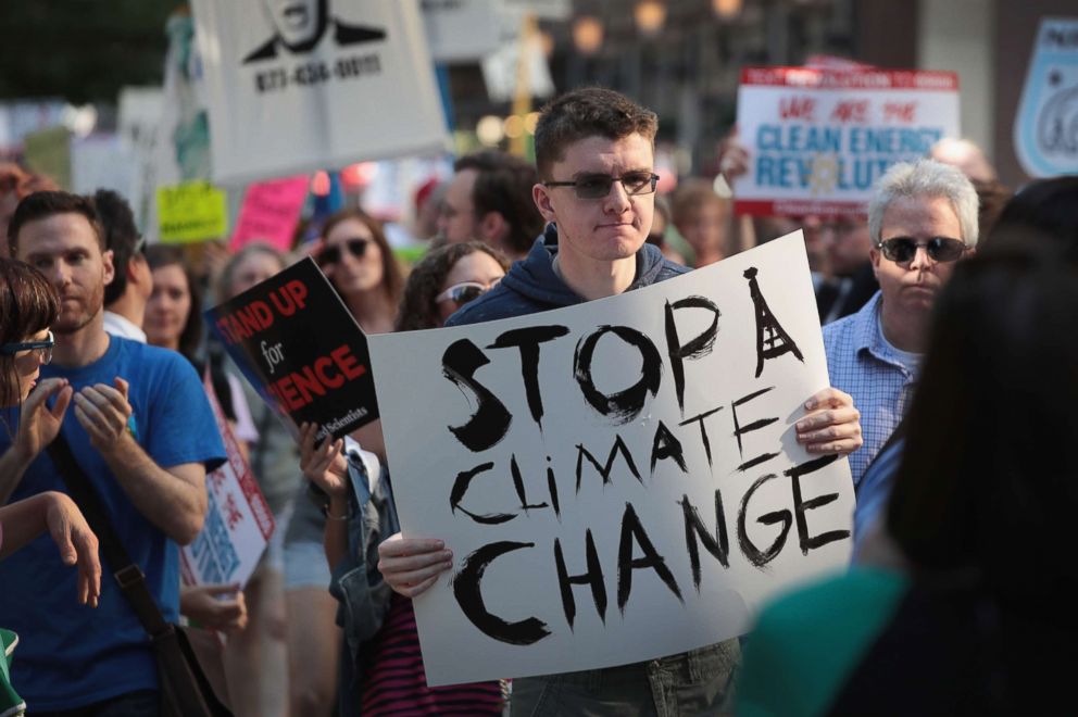 PHOTO: Demonstrators protest President Donald Trump's decision to exit the Paris climate change accord on June 2, 2017 in Chicago.