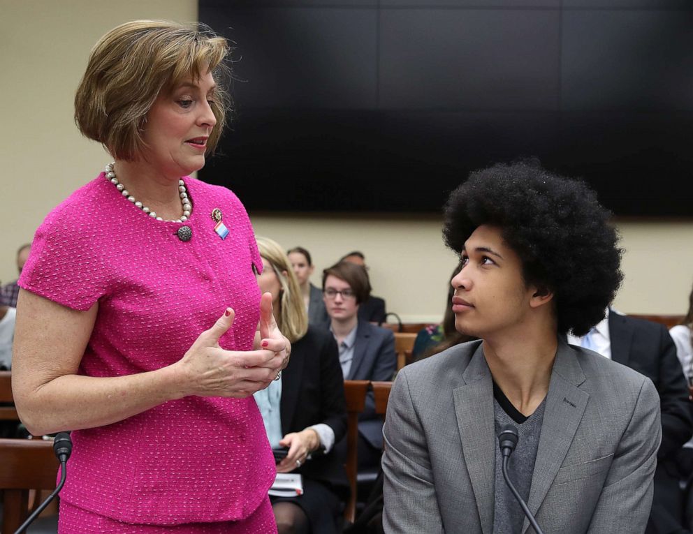 PHOTO: Rep. Kathy Castor talks with Aji Piper, a plaintiff in the Juliana v. United States climate lawsuit, at the first hearing of the House Select Committee on the Climate Crisis, on Capitol Hill, April 4, 2019, in Washington.