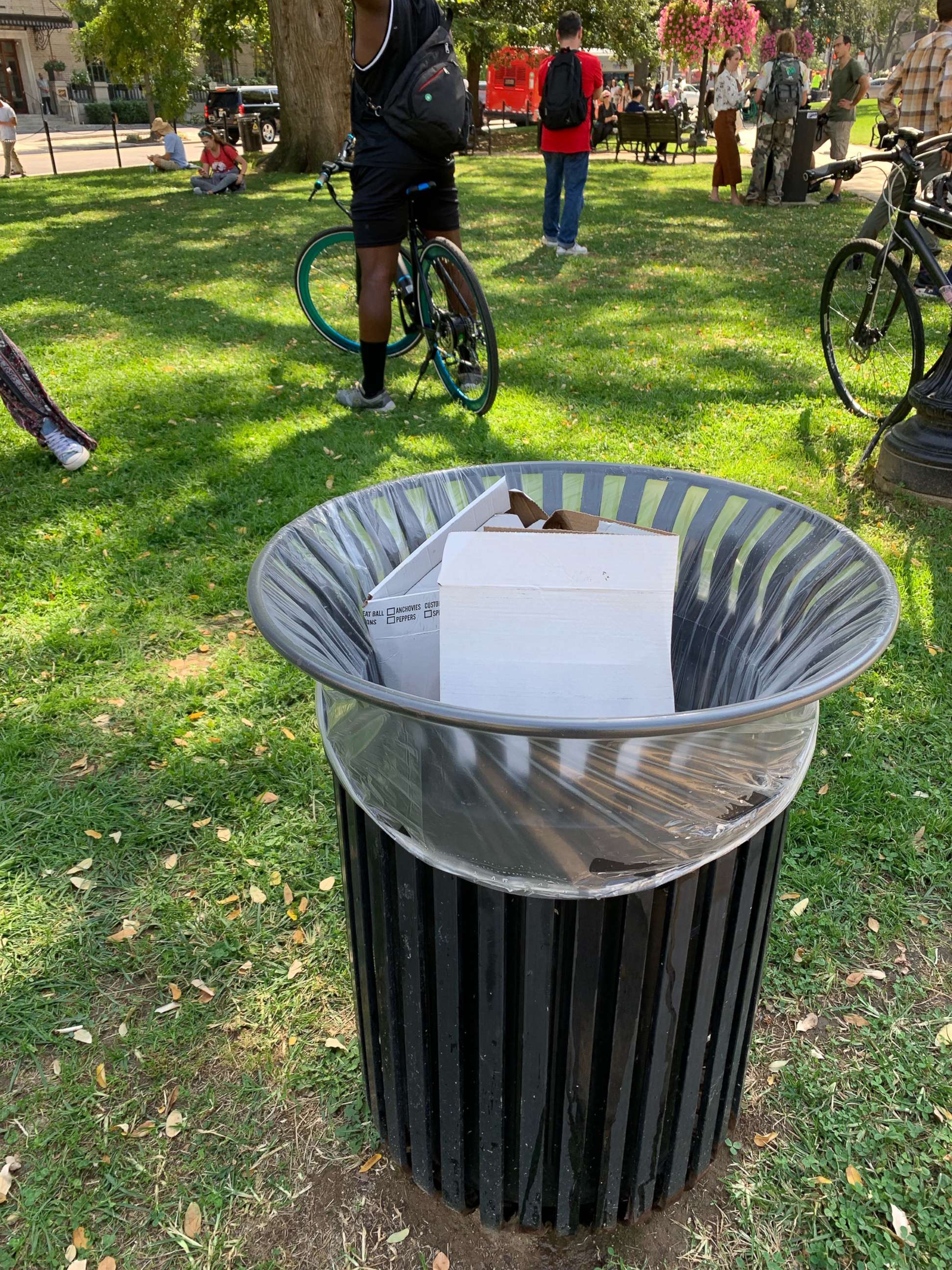 PHOTO: Climate change activists ate pizza after their protest finished in Washington on September 23rd, 2019. Some of the boxes were thrown away in trash cans.