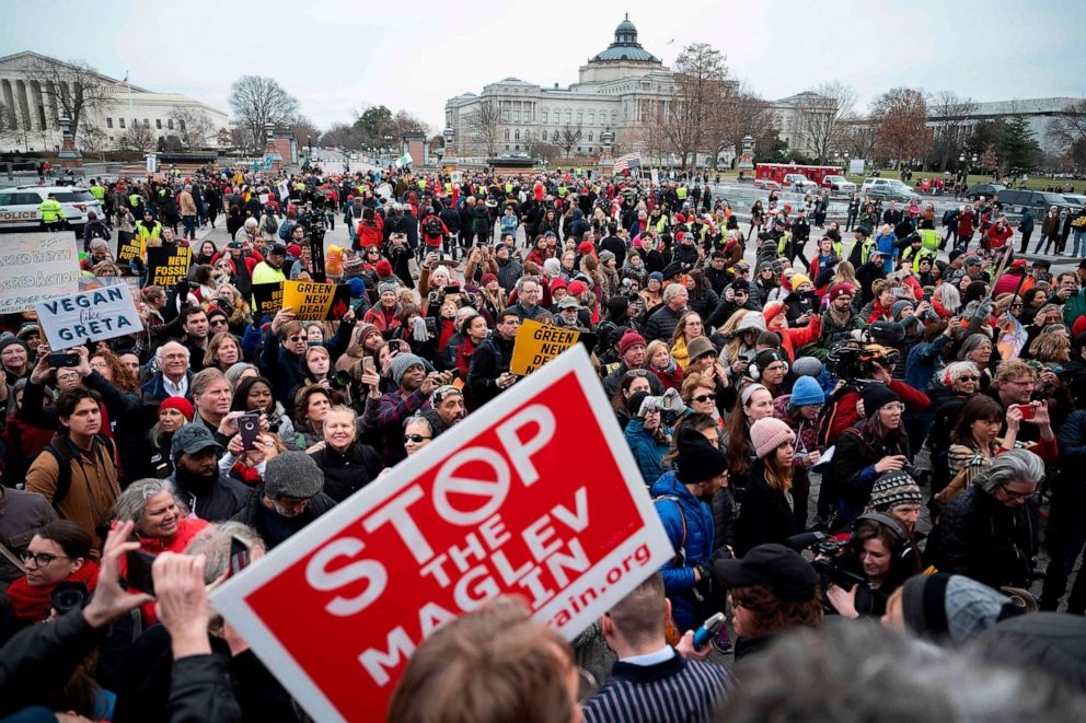 PHOTO: People march toward the U.S. Capitol steps during Fonda-Fire Drill Friday with actress Jane Fonda (not pictured) to protest fossil fuel companies, in Washington on January 10, 2020. 