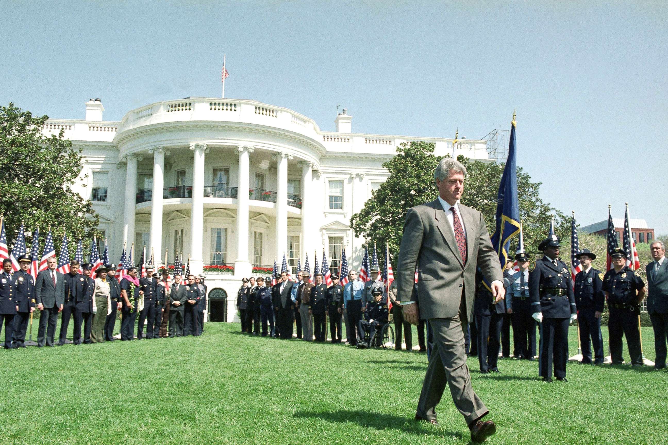 PHOTO: President Bill Clinton walks on the South Lawn of the White House, April 14, 1994, where he discussed his crime bill package with mayors and law enforcement officials. 