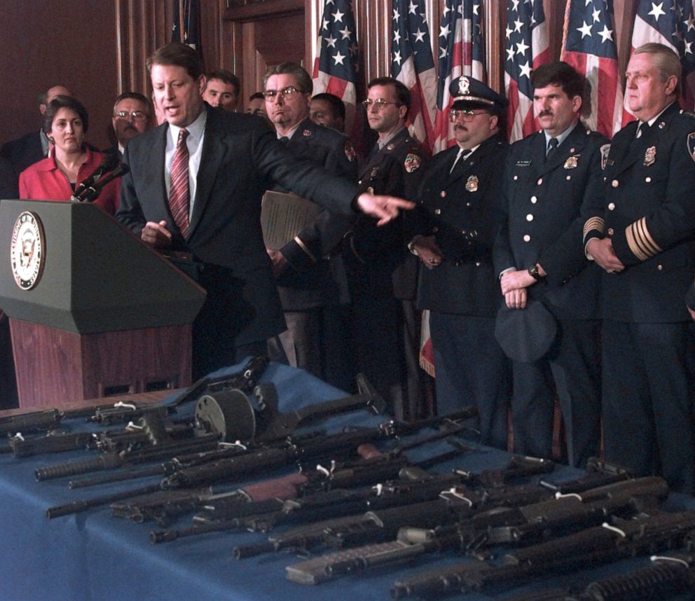 PHOTO: Vice President Al Gore, flanked by Deputy Attorney General Jaime Gorelick, far left, and Maryland Police Superintendent David Mitchell, gestures toward various assault weapons during a news conference in Washington  D.C., March 22, 1996. 