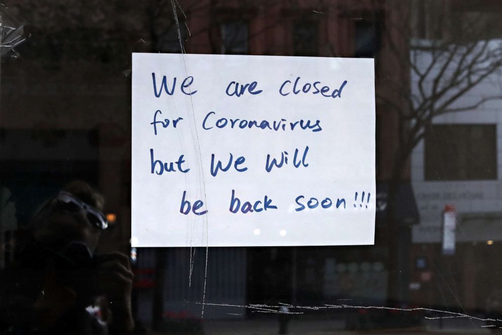 PHOTO: A sign in a restaurant window reads 'we are closed for coronavirus but we will be back soon!!!' during the COVID-19 pandemic on April 21, 2020 in New York.