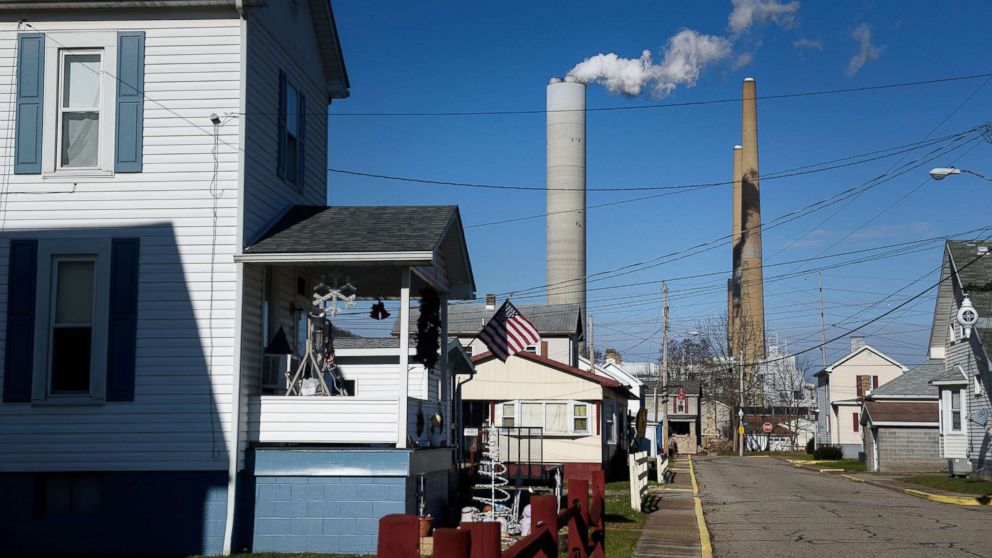 The FirstEnergy Corp. W.H. Sammis Plant coal-fired power plant stands behind houses in Stratton, Ohio, Dec. 6, 2017.