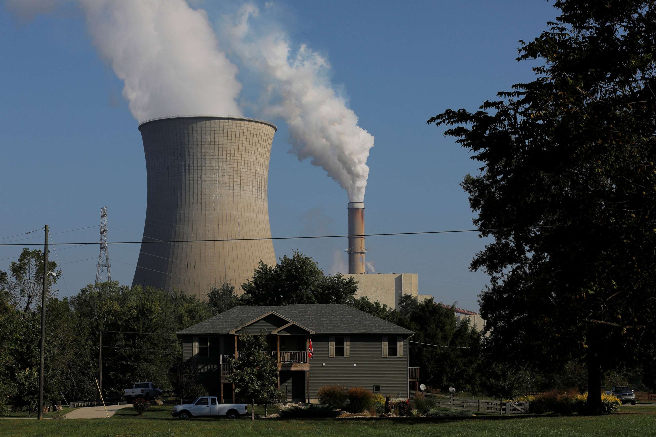 PHOTO: In this File photo, a home sits in front of the William H. Zimmer Power Station, a coal-fired power-plant, along the Ohio River in Moscow, Ohio, U.S., September 23, 2017.