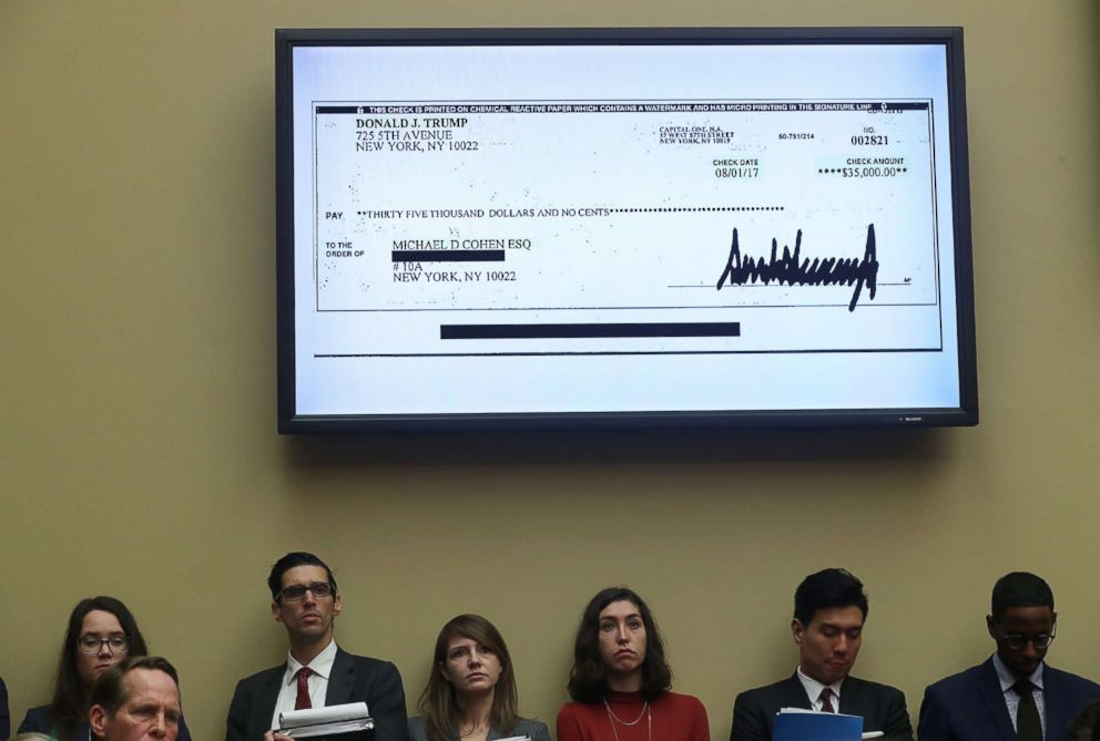 PHOTO: A $35,000 check signed by President Donald Trump to Michael Cohen, his former personal attorney, is shown on a television monitor inside the hearing room as Cohen testifies in Washington, D.C., Feb. 27, 2019.