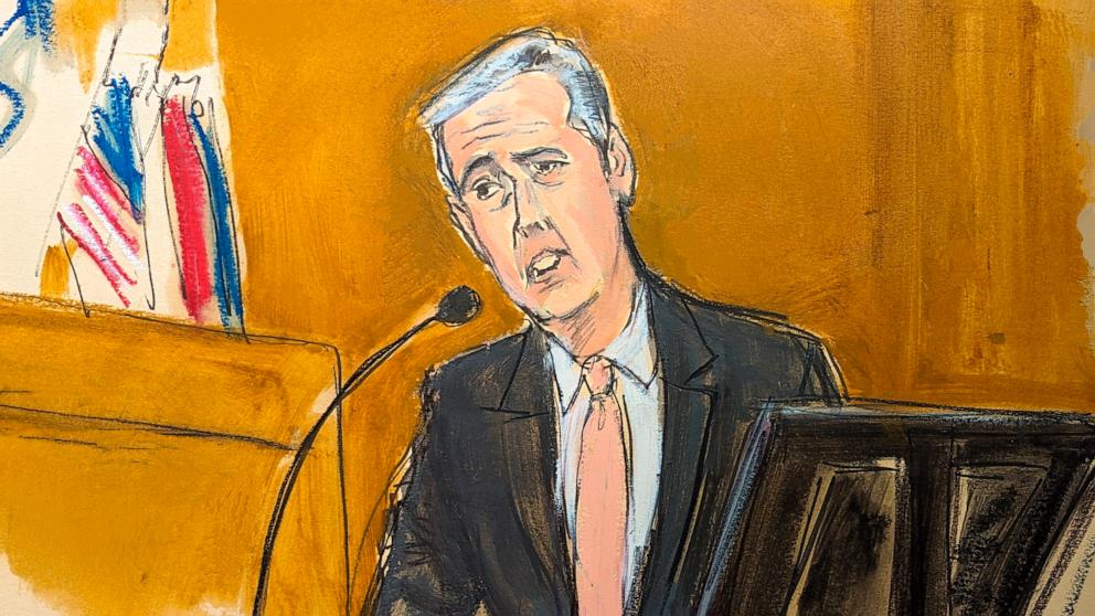 PHOTO: Michael Cohen testifies on the witness stand with a National Enquirer cover story about Donald Trump displayed on a screen in Manhattan criminal court, May 13, 2024, in New York.