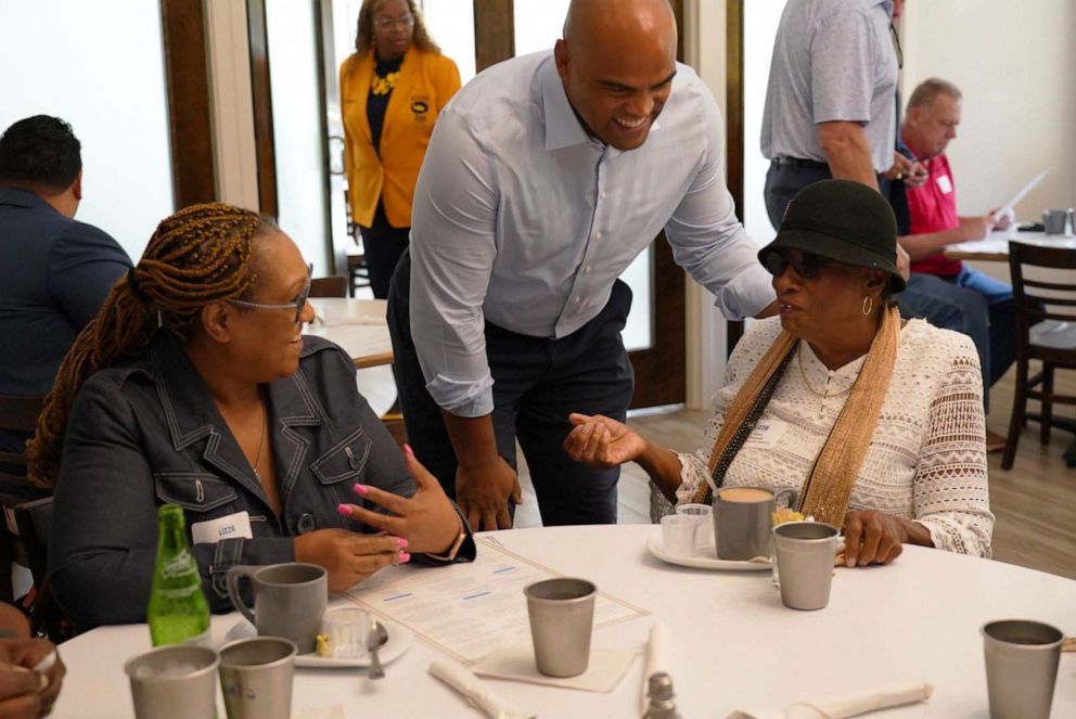 PHOTO: Allred greets labor union leaders at breakfast on Friday.